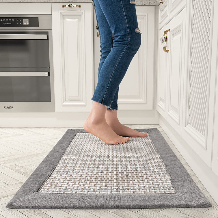 Light grey kitchen rug things in the kitchen